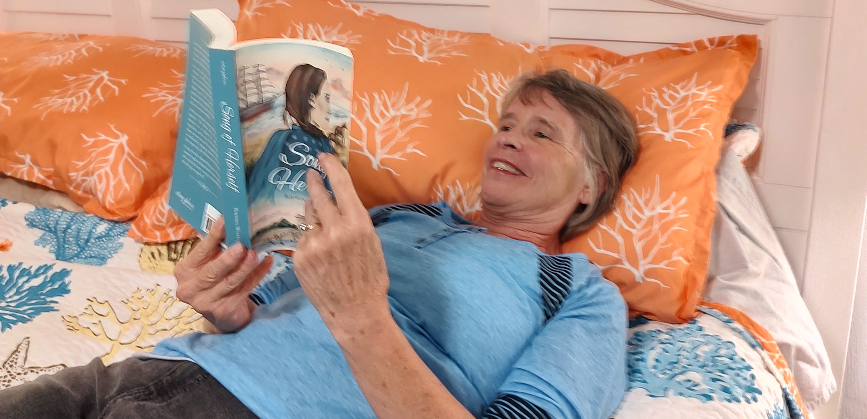 Reader reading, Song of Herself, in bed